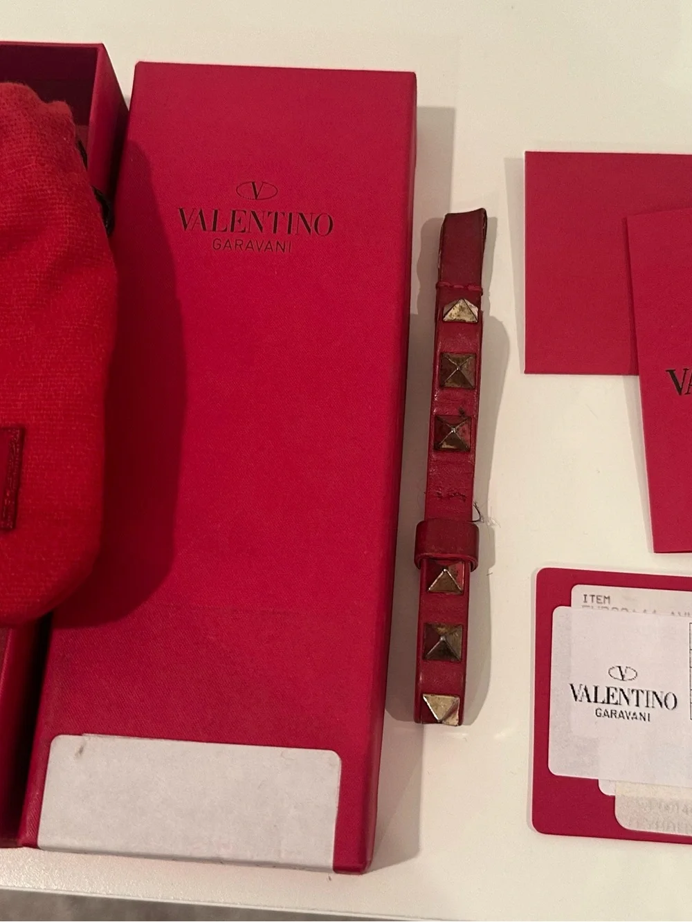 Valentino Garavani Rockstud Key chain Strap in Red with Gold Studs.
